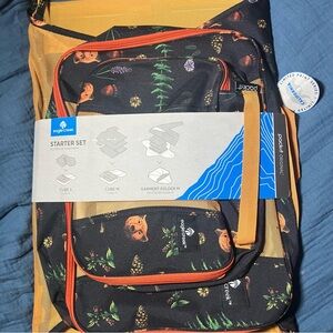 Eagle Creek packing cube set with garment folding bag. California bear print.